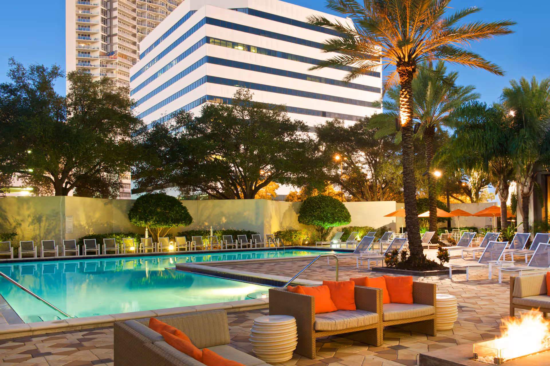 Hilton St. Petersburg Bayfront pool area with fire pit